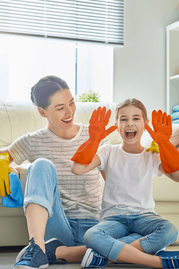 woman and daughter cleaning house quickly