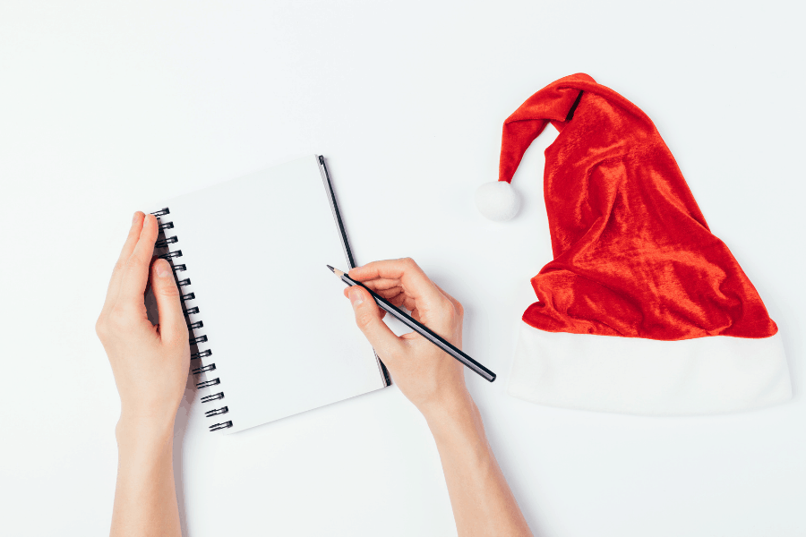 woman making a christmas list