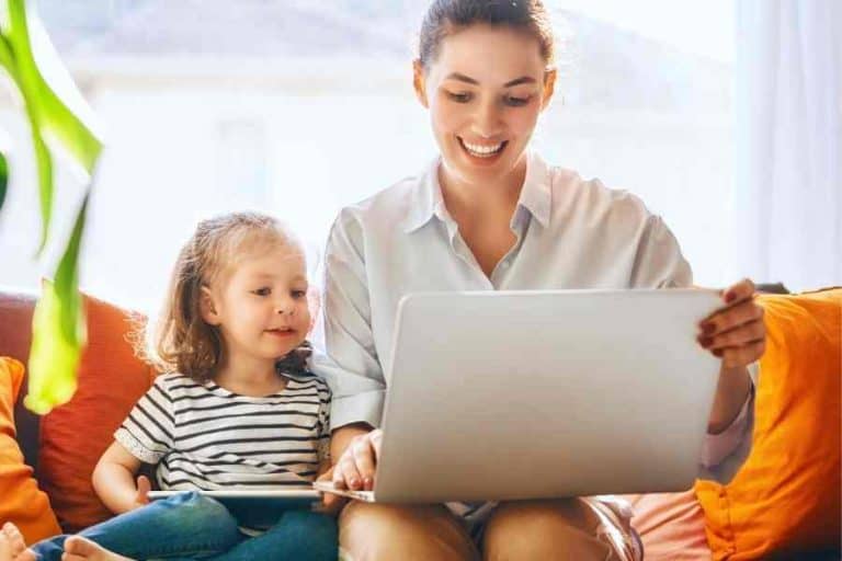 busy mom using a laptop