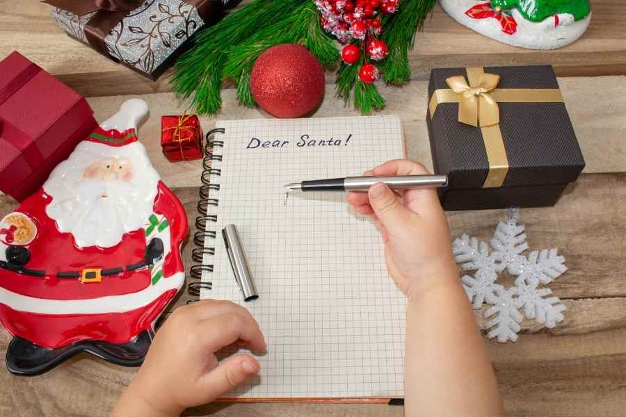 child making a christmas wish list