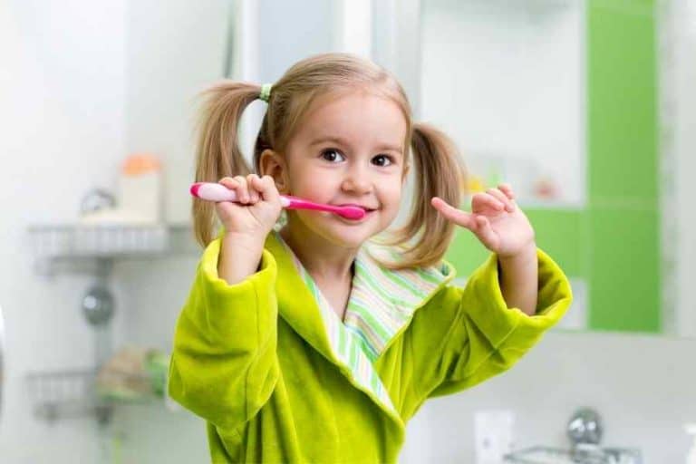 child brushing teeth