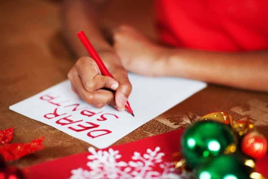 little girl writing a letter to santa