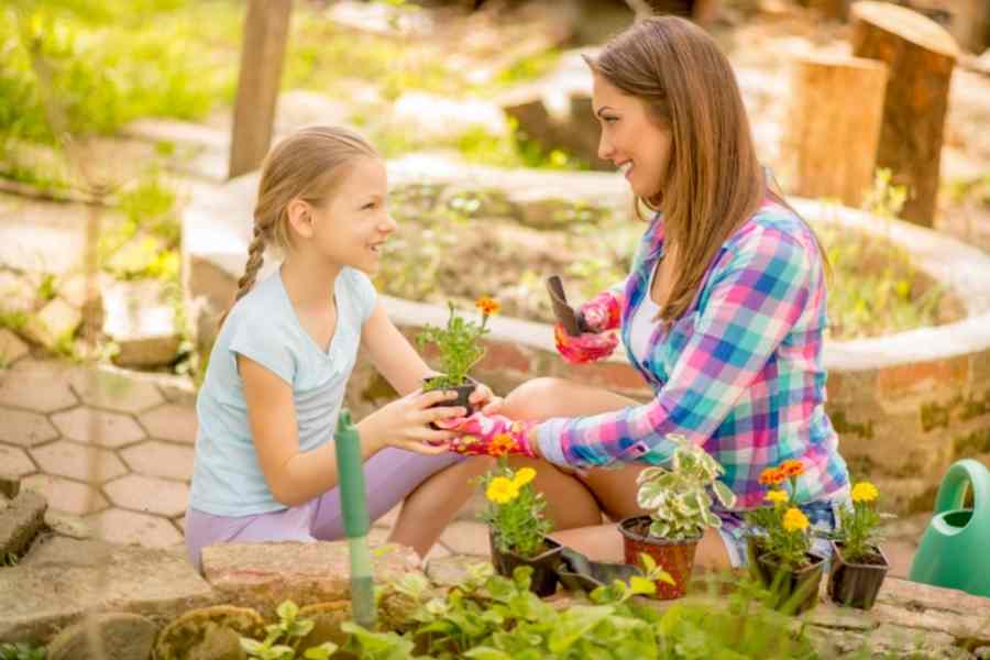 woman and daughter gardening