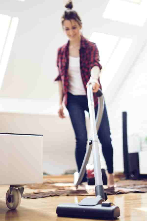 woman vacuuming a living room